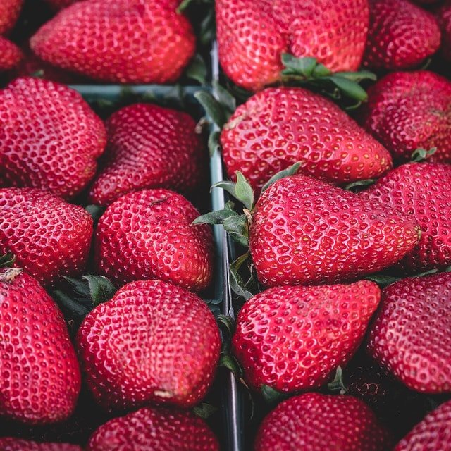 Fresh ripe strawberries in a market display